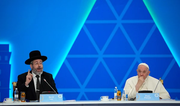 Israeli Ashkenazi Chief Rabbi David Lau delivers his speech flanked by Pope Francis during the '7th Congress of Leaders of World and Traditional Religions', at the Palace of Peace and Reconciliation, in Nur-Sultan, Kazakhstan, September 15, 2022 (AP)