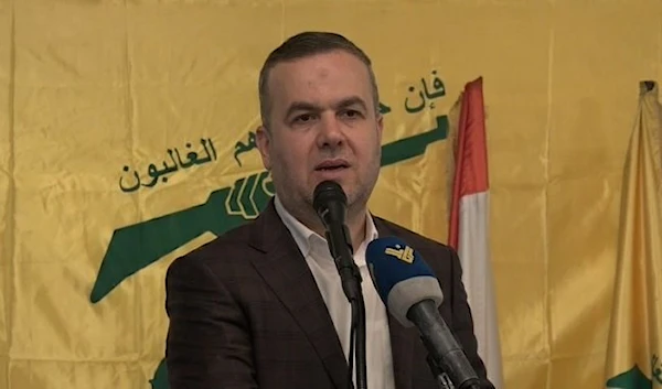 Loyalty to the Resistance Bloc MP, Hassan Fadlallah, speaking at a press conference with the flags of the Islamic Resistance and Lebanon displayed behind him-undated- (social media)