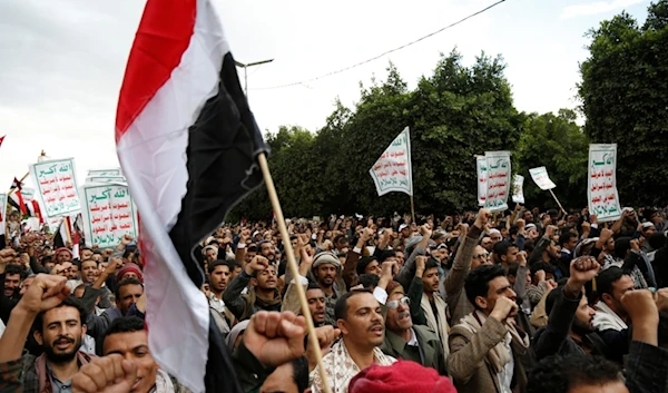 Ansar Allah supporters chant slogans as they attend a rally marking eight years for a Saudi-led coalition, Friday, March 26, 2023, in Sanaa, Yemen. (AP Photo/Hani Mohammed)