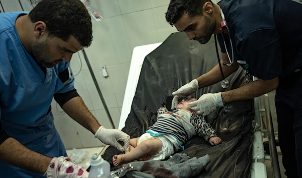 A Palestinian baby wounded in Israeli bombardment of the Gaza Strip is treated in a hospital in Khan Younis, Friday, Dec. 1, 2023. (AP)