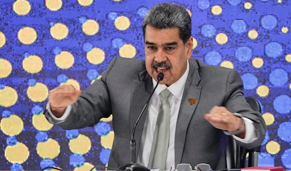 Venezuela's President Nicolas Maduro speaks during the notification ceremony for the referendum about the future of a disputed territory with Guyana, in Caracas, Venezuela, Dec. 4, 2023 (AP Photo/Ariana Cubillos)