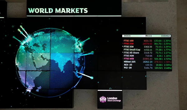 Financial market information is displayed inside the London Stock Exchange in the City of London, Tuesday, Aug. 25, 2015. (AP)