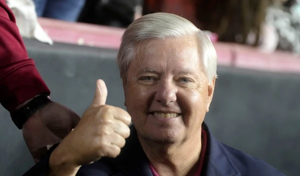 Sen. Lindsey Graham gives a thumbs up on the sidelines of the annual football match between the University of South Carolina and Clemson University on Saturday, Nov. 25, 2023 (AP)