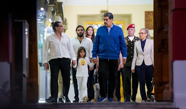 Venezuelan President Maduro and Alex Saab, left, walk out the Miraflores presidential palace after a meeting in Caracas, Venezuela, Wednesday, Dec. 20, 2023. (AP)