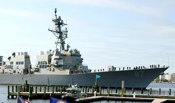 The USS Mason, an Arleigh Burke-class destroyer, passes a dock in Norfolk, Virginia, US, April 8, 2021. (AP)