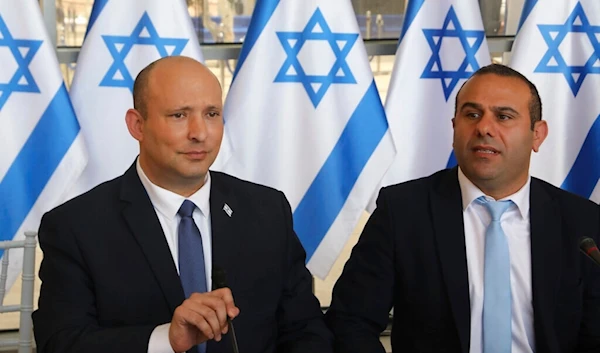 Then-Israeli Prime Minister Naftali Bennet, left, chairs a weekly cabinet meeting in occupied al-Quds, occupied Palestine, May 29, 2022