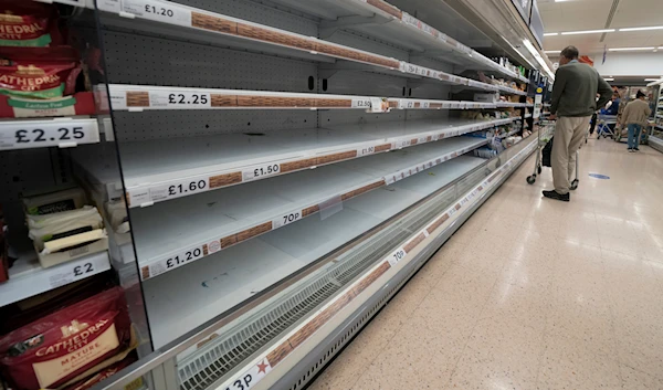 A view of empty shelves at a Tesco supermarket in Manchester, England, Sunday, Sept 12, 2021. (AP)