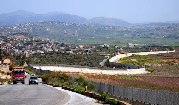 Cars drive in the village of Kfar Kila, on the Lebanese-Israeli border in southeast Lebanon, Friday, April 7, 2023. (AP)