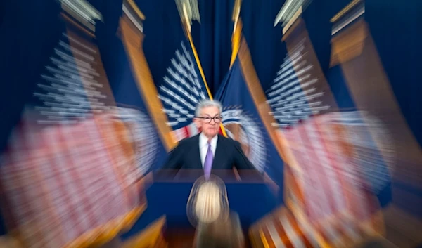 In this photo made with a slow shutter speed, Federal Reserve Board Chair Jerome Powell speaks during a news conference on Dec. 13, 2023, in Washington. (AP)