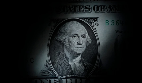 The likeness of George Washington is seen on a U.S. one dollar bill, March 13, 2023 (AP)