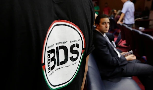 An Egyptian wears a T-shirt with a logo of BDS (Boycott, Divestment and Sanctions), a campaign by Palestinians to boycott Israel and Israeli-made goods on April 20, 2015 (AP)