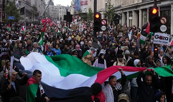 Protesters march during a pro Palestinian demonstration in London, Saturday, Oct. 14, 2023.  (AP)