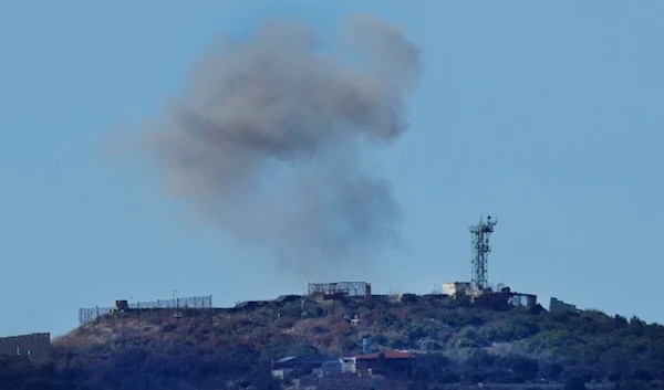 Smoke rises from an Israeli army position which was hit by Hezbollah shells as it is seen from Rmeish, a Lebanese border village with Israel, in south Lebanon, Tuesday, Nov. 21, 2023 (AP)