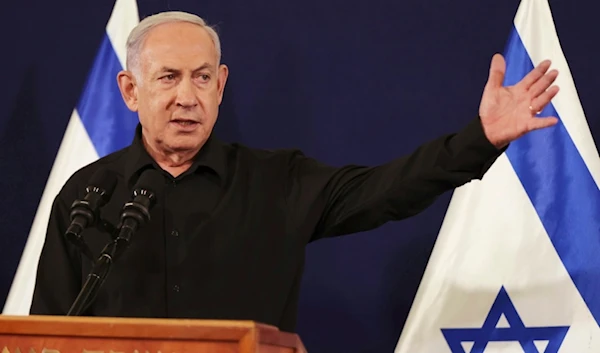 Israeli Prime Minister Benjamin Netanyahu speaks during a press conference with Defense Minister Yoav Gallant and Cabinet Minister Benny Gantz in the Kirya military base