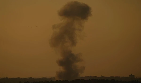 Smoke rises following an Israeli bombardment in the Gaza Strip, as seen from southern occupied Palestine, Wednesday, Dec. 6, 2023. (AP Photo/Ariel Schalit)