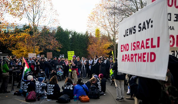 Protesters gather to occupy the main entrance to the Space Needle during a rally demanding that Sen. Patty Murray, D-Wash., call for a cease-fire in the war on Gaza, Sunday, Nov. 19, 2023, in Seattle. (AP)