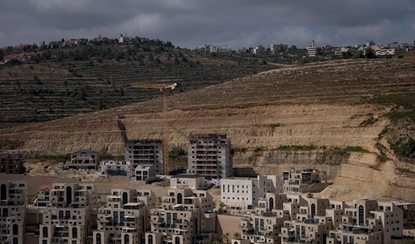 This photo shows a construction site of new housing projects in the West Bank Israeli settlement of Givat Ze'ev, Monday, June 18, 2023. (AP)