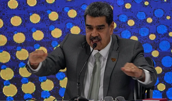 Venezuela's President Nicolas Maduro speaks during the notification ceremony for the referendum about the future of a disputed territory with Guyana, in Caracas, Venezuela, Monday, Dec. 4, 2023. (AP)