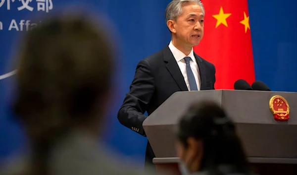 Chinese Foreign Ministry spokesperson Wang Wenbin speaks during a regular press conference in Beijing, Tuesday, May 9, 2023 (AP)