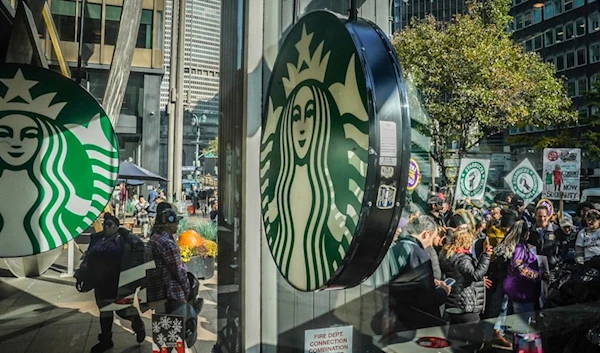 A coalition of unions and supporters join Starbucks workers at a rally outside a midtown Manhattan Starbucks coffee store, Thursday, Nov. 16, 2023, in New York. (AP)