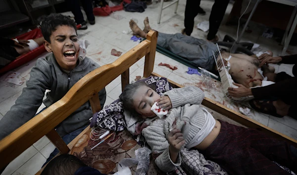 Palestinians wounded in the Israeli bombardment of the Gaza Strip arrive at a hospital in Khan Younis on Friday, Dec. 8, 2023. (AP)