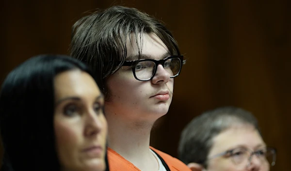 Ethan Crumbley stands with his attorneys, Paulette Loftin and Amy Hopp, during his hearing at Oakland County Circuit Court, Aug. 1, 2023, in Pontiac, Mich. (AP)