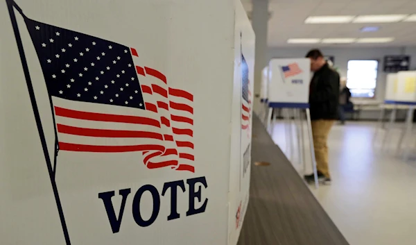 A man votes during early election in Cleveland March 30, 2020 (AP).