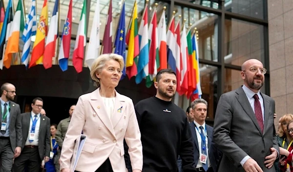 From left, European Commission President Ursula von der Leyen, Ukraine's President Volodymyr Zelenskyy and European Council President Charles Michel walk together to a media conference at an EU summit in Brussels, Feb. 9, 2023.