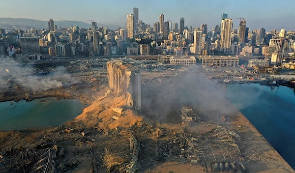 In this August 5, 2020 file photo, a drone picture shows the destruction after an explosion at the seaport of Beirut, Lebanon (AP Photo/Hussein Malla, File)