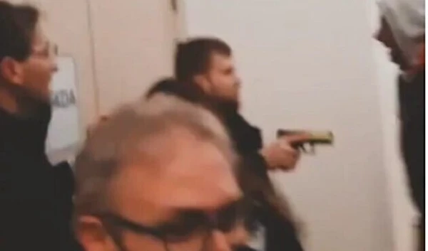 Security guar holds gun at pro-Palestine students on University campus