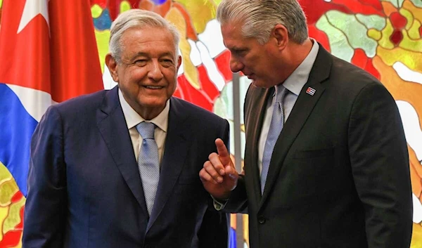 Cuban President Miguel Diaz Canel, right, and Mexico's President Andrés Manuel López Obrador speak after signing bilateral agreements at Revolution Palace in Havana, Cuba, May 8, 2022 (AP Photo)