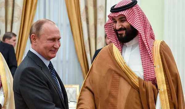 Russian President Vladimir Putin and Saudi Crown Prince Mohammed bin Salman at the Kremlin (AFP)