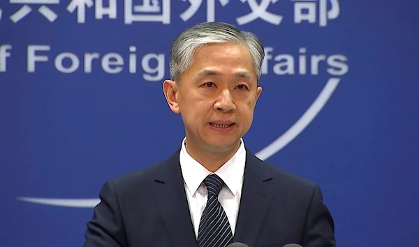 China's Foreign Ministry spokesperson Wang Wenbin speaks during the daily briefing in Beijing, June 11, 2021 (AP Photo/Liu Zheng, File)