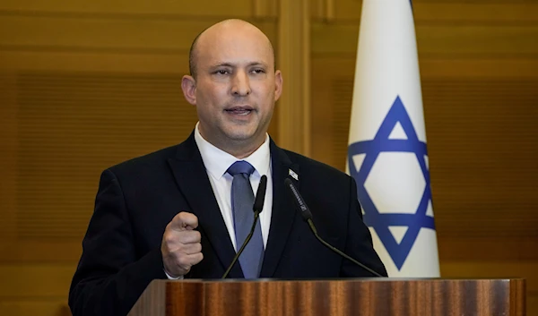 Israeli Prime Minister Naftali Bennett delivers a statement at the Israeli Knesset, in occupied Al-Quds, occupied Palestine, on June 29, 2022 (AP Photo)