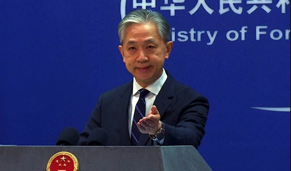 In this image made from video, Chinese Foreign Ministry spokesperson Wang Wenbin speaks during a media briefing at the Ministry of Foreign Affairs office in Beijing, Monday, Feb. 13, 2023 (AP Photo/Liu Zheng)