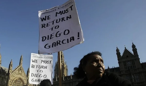 Chagossians protest outside the Houses of Parliament in London. (AP)