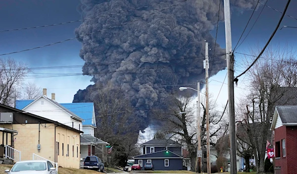 A large plume of smoke rises over East Palestine, Ohio, after a controlled detonation of a portion of the derailed Norfolk Southern trains Monday, Feb. 6, 2023 (AP Photo/Gene J. Puskar)