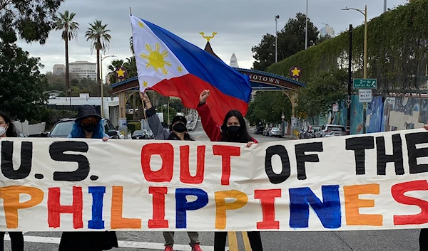 Filipino American activists hold a rally by the Historic Filipinotown Gateway in protest of the recent announcement that will give the U.S. access to 9 military bases in the Philippines on February 17, 2023 (ABS-CBN via Twitter).