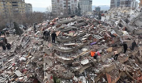 Civilians look for survivors under the rubble of collapsed buildings in Kahramanmaras, close to the quake’s epicentre, the day after a 7.8-magnitude earthquake struck the country’s southeast, on February 7, 2023. (AFP)