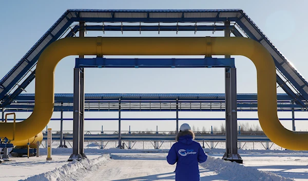 An employee at Gazprom's Power Of Siberia gas pipeline in Russia in 2019 (Reuters)