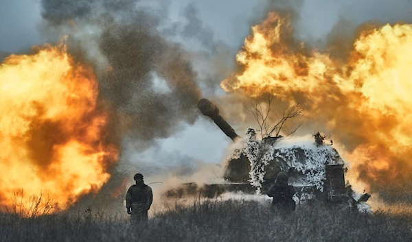 Ukrainian soldiers fire a self-propelled artillery vehicle on the frontline, Donetsk region, Saturday, Feb. 18, 2023. (AP Photo/Libkos)