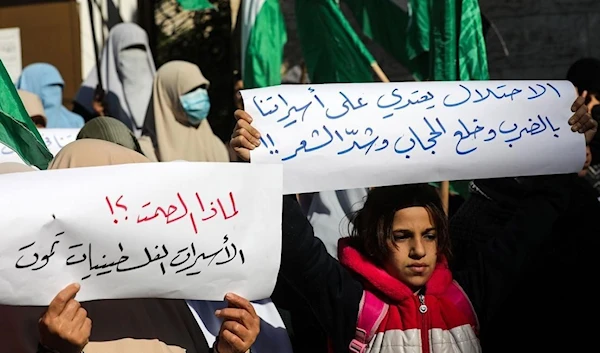 Female prisoners carry out a protest against punitive measures imposed by Israeli occupation against prisoners