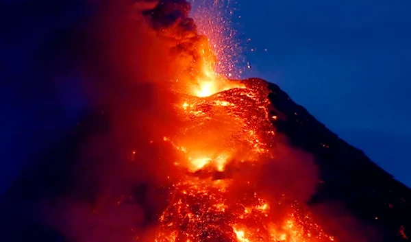 Mayon volcano spews red -hot lava in another eruption as seen from Legazpi city, Albay province, roughly 340 kilometers southeast of Manila, Philippines, Tuesday, Jan. 23, 2018 (AP).