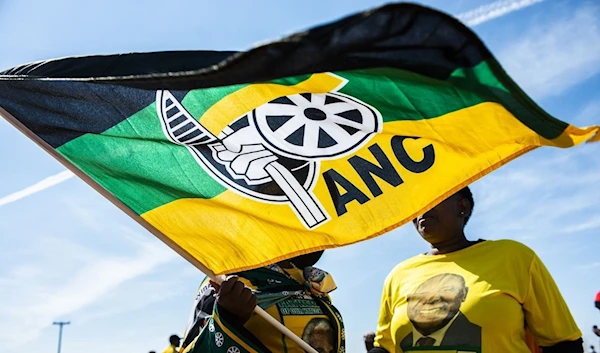 Supporters wave a flag during an African National Congress party event in Bloemfontein, South Africa (Bloomberg).