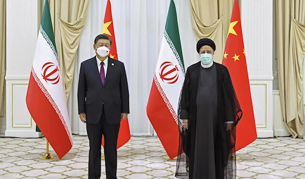 Iran's President Ebrahim Raisi, right, and Chinese President Xi Jinping pose for a photo on the sidelines of a meeting at the Shanghai Cooperation Organization (SCO) summit in Samarkand, Uzbekistan on Sept. 16, 2022. (AP)