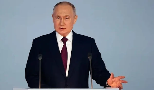 Russian President Vladimir Putin gestures as he gives his annual state of the nation address in Moscow, Russia, Tuesday, Feb. 21, 2023. (AP)