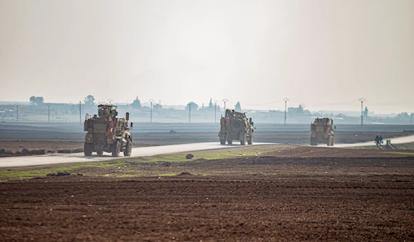 US military vehicles on a patrol in the countryside near the town of Qamishli, Syria, Sunday, Dec. 4, 2022 (AP Photo/Baderkhan Ahmad, File)