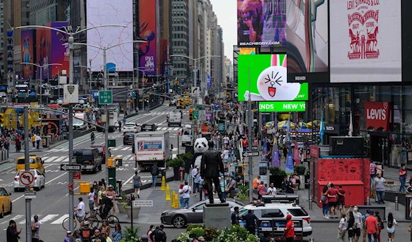 People walk through Times Square in New York City, US, July 13, 2021 (AFP)