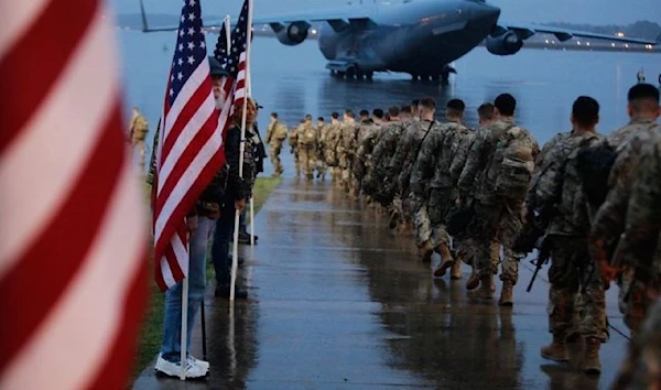 Paratroopers assigned to 1st Brigade Combat Team, 82nd Airborne Division load aircraft (AFP)