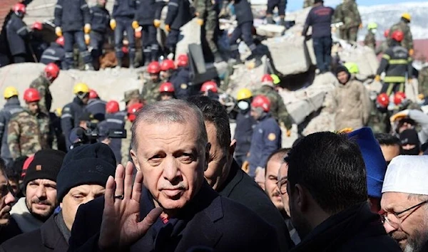 Turkish President Recep Tayyip Erdogan tours the site of destroyed buildings during his visit to the city of Kahramanmaras in southeast Turkey two days after the severe earthquake that hit the region, Feb. 8, 2023. (AFP)